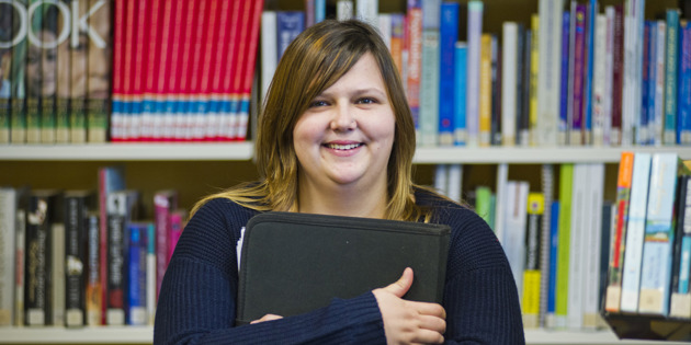student in library