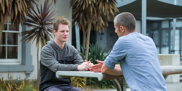 Niall talking with student