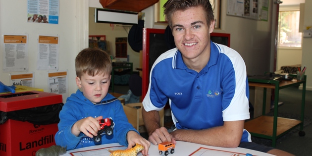 Toby Bishop with child at daycare