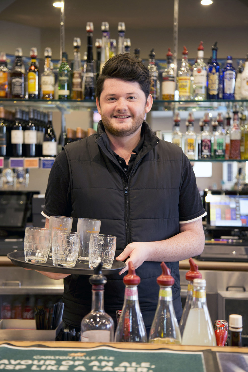 James working as a bar tender