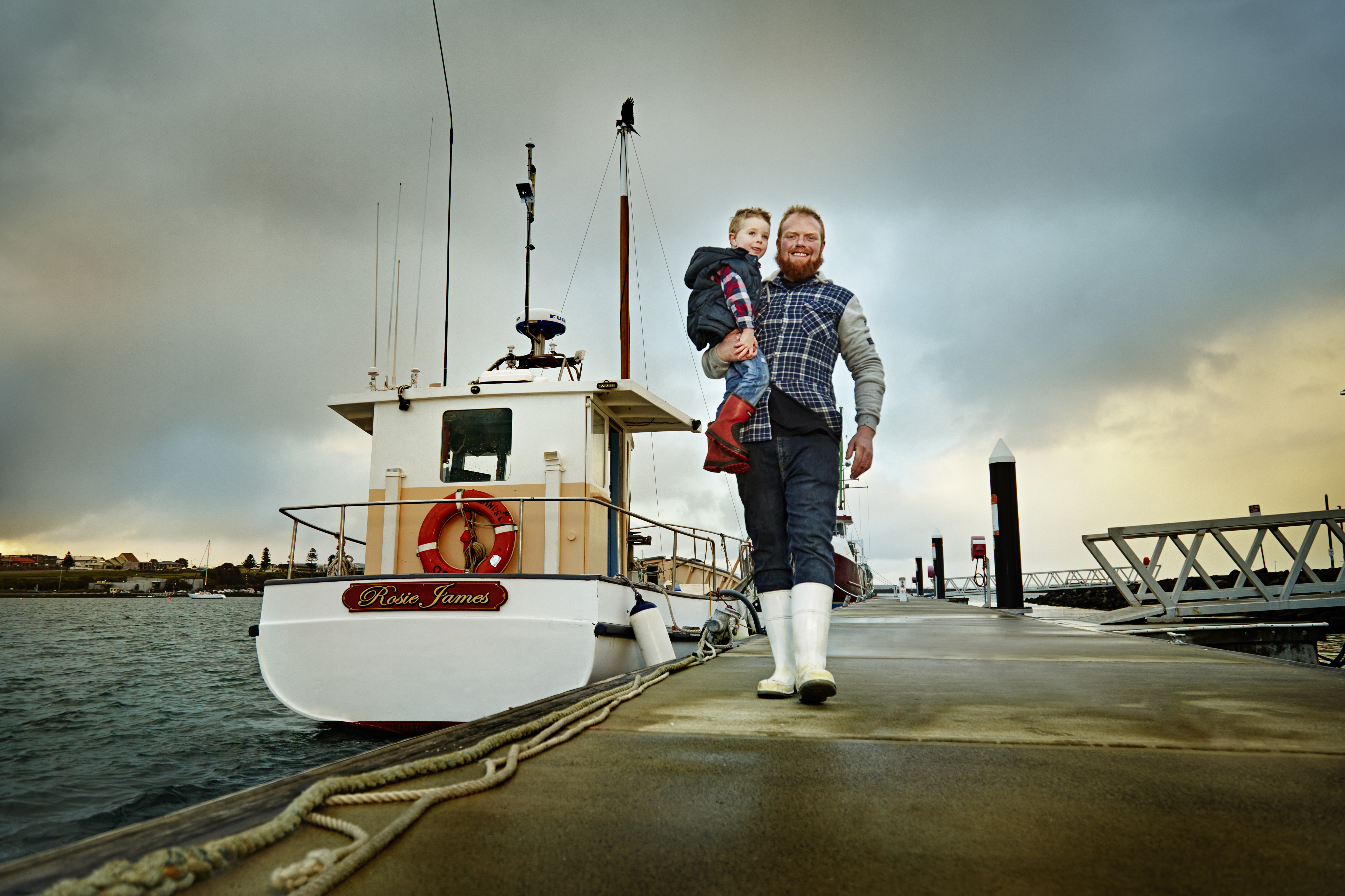 Matthew with his son at the pier