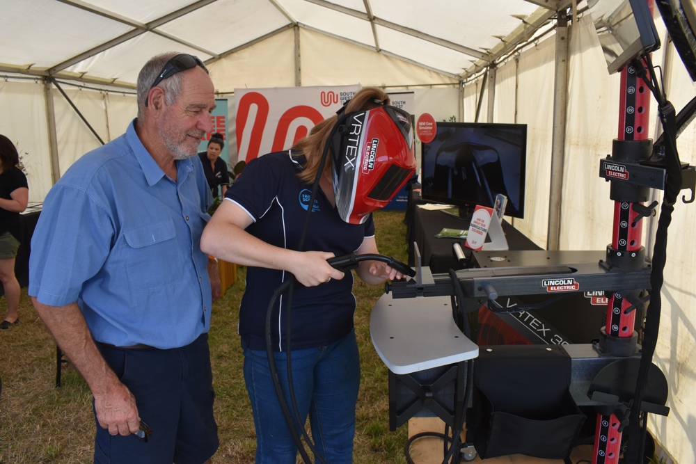 South West TAFE agriculture teacher Peter McSween supervises Emmanuel College year 10 student Amarli McKenna.