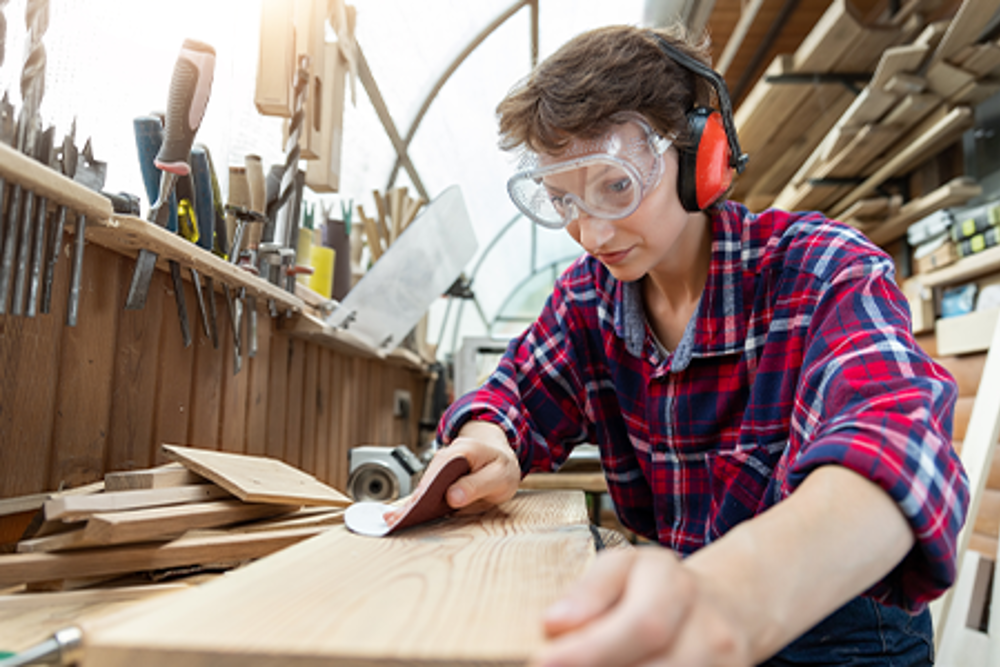 carpenter sanding wood